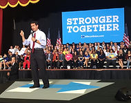Eugene DePasquale speaking with 'Stronger Together' sign, advocating unity and strength in his Pennsylvania AG 2024 campaign.